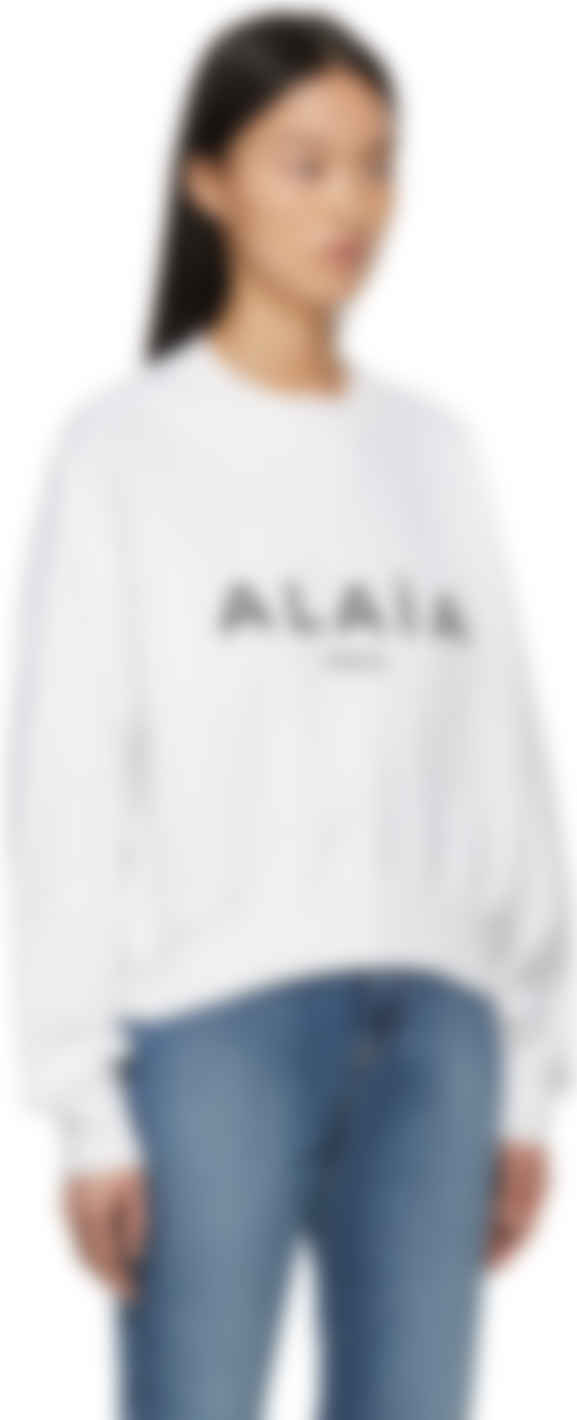white boxy sweater
