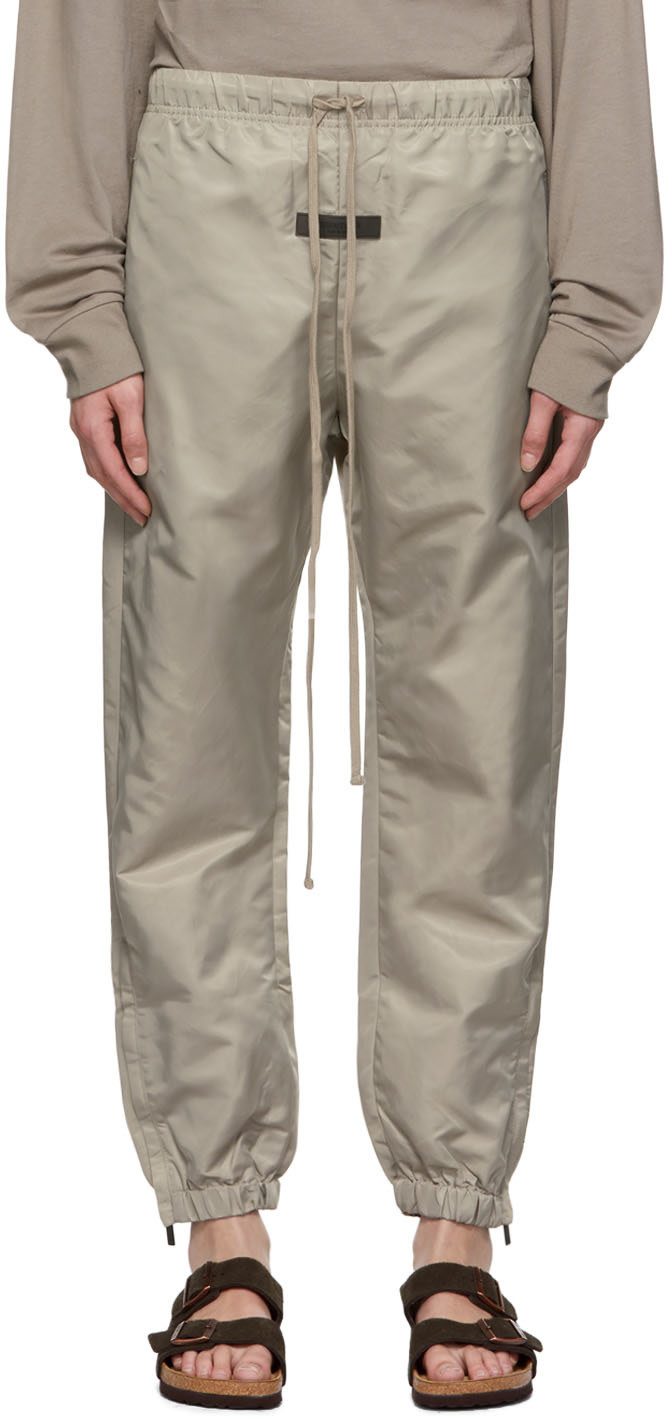 パンツ FEAR OF GOD ESSENTIALS NYLON TRACK PANTS Fear of God ESSENTIALS: Taupe Nylon Track Pants | SSENSE Canada