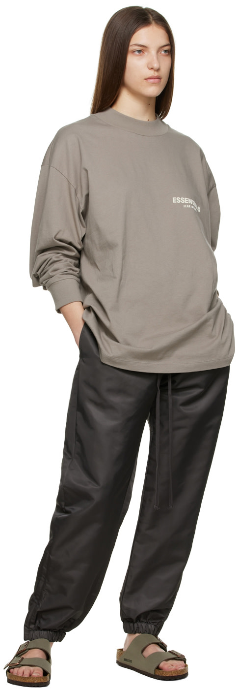 Fear of God ESSENTIALS: Black Nylon Track Pants | SSENSE Canada