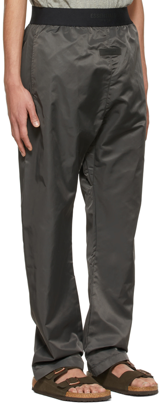 Fear of God ESSENTIALS: Black Nylon Track Pants | SSENSE United