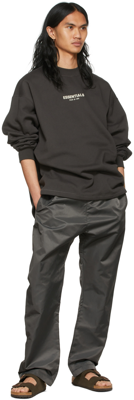Fear of God ESSENTIALS: Black Nylon Track Pants | SSENSE United