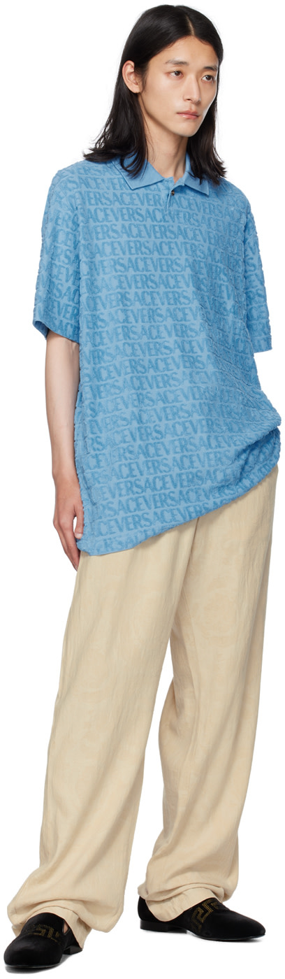 Versace - Polo bleu à motif à logos