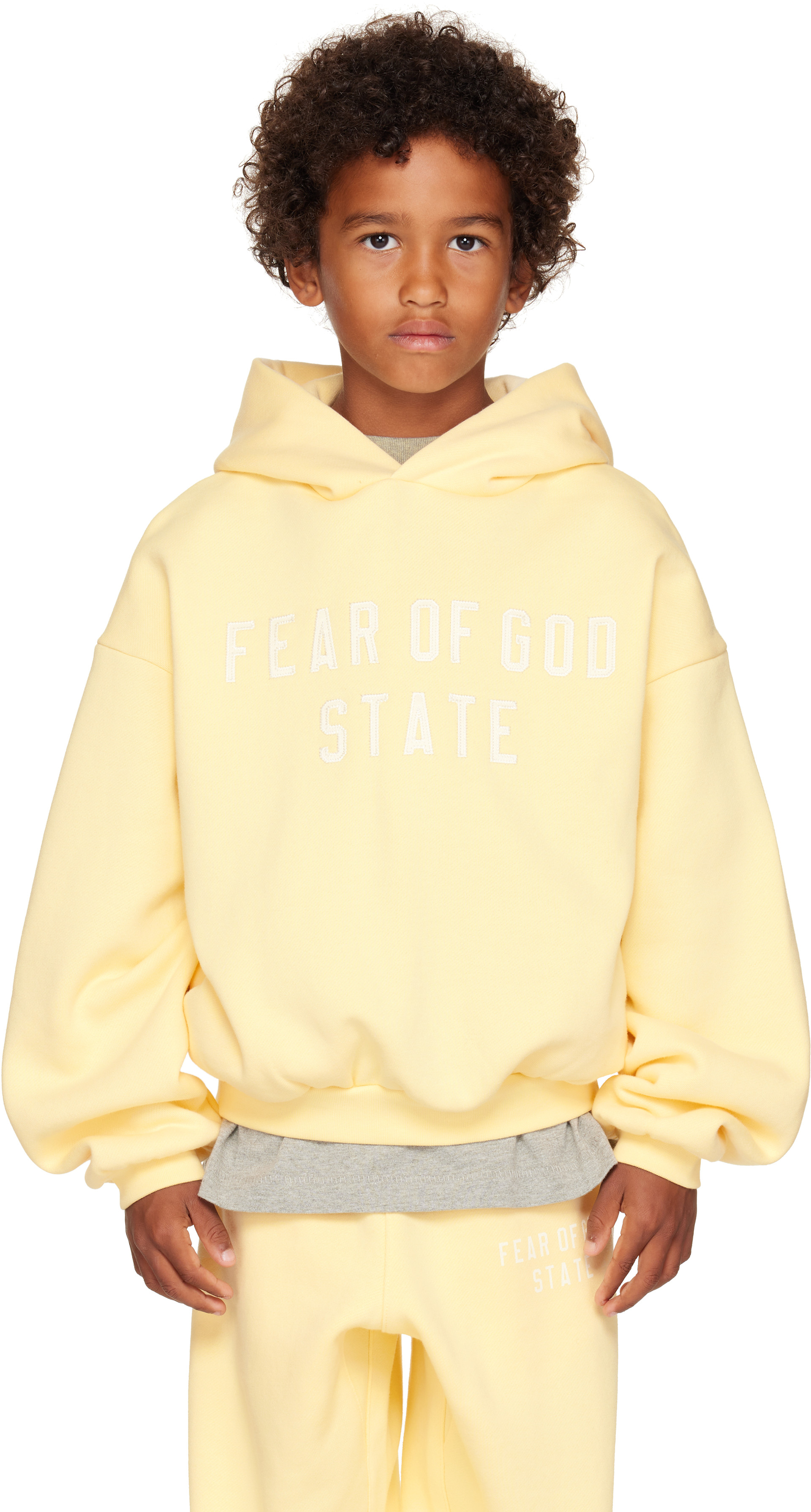 Fear of God ESSENTIALS: Kids Yellow 90s Fit Fleece Hoodie | SSENSE
