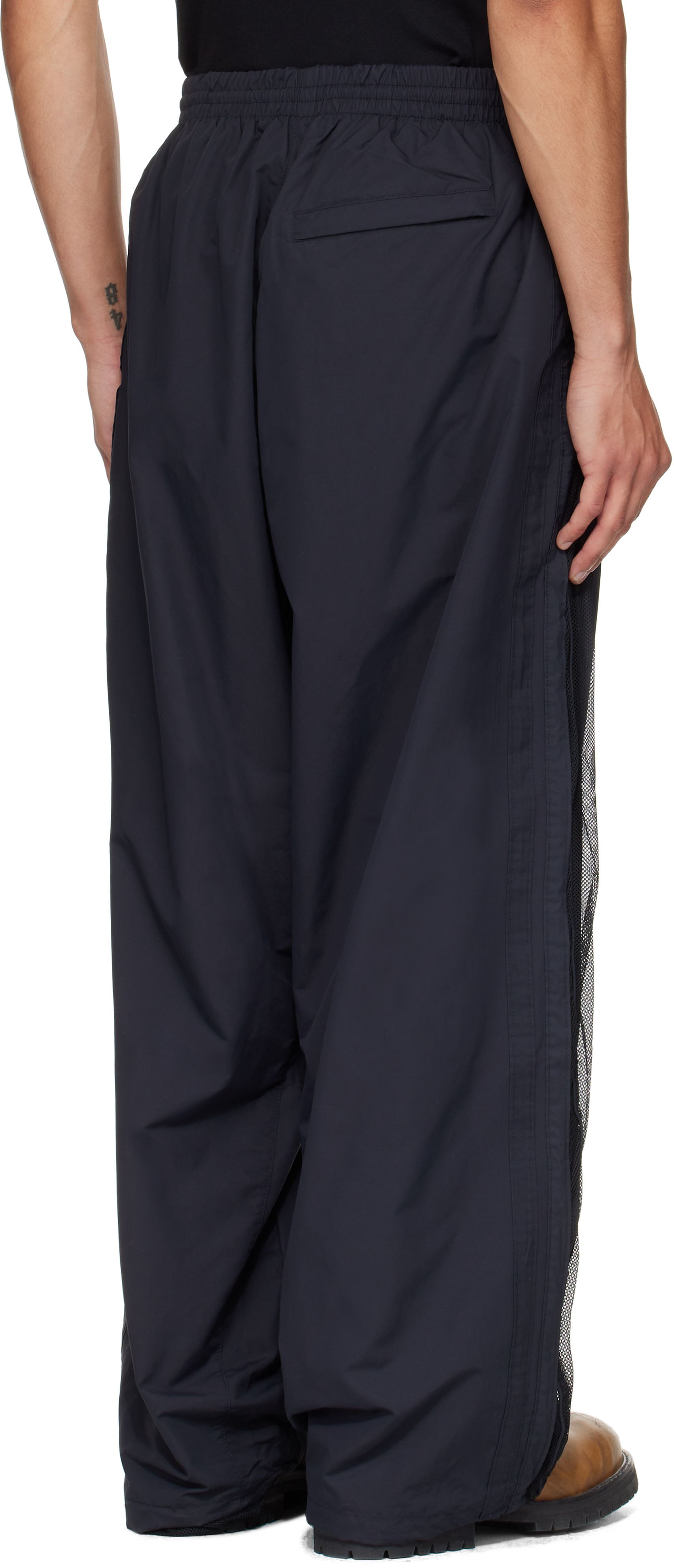 VETEMENTS: Black Mesh Panel Track Pants | SSENSE