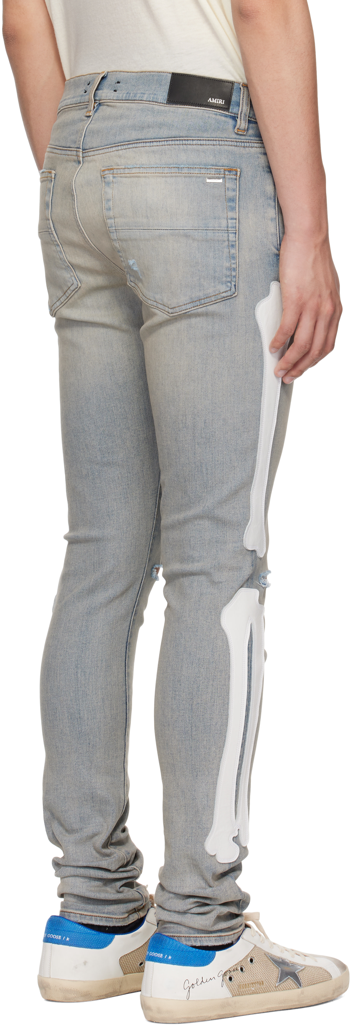 AMIRI: Blue Bones Slash Jeans | SSENSE