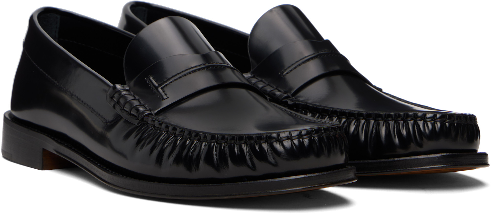 TOM FORD: Black Burnished Leather Penny Loafers | SSENSE