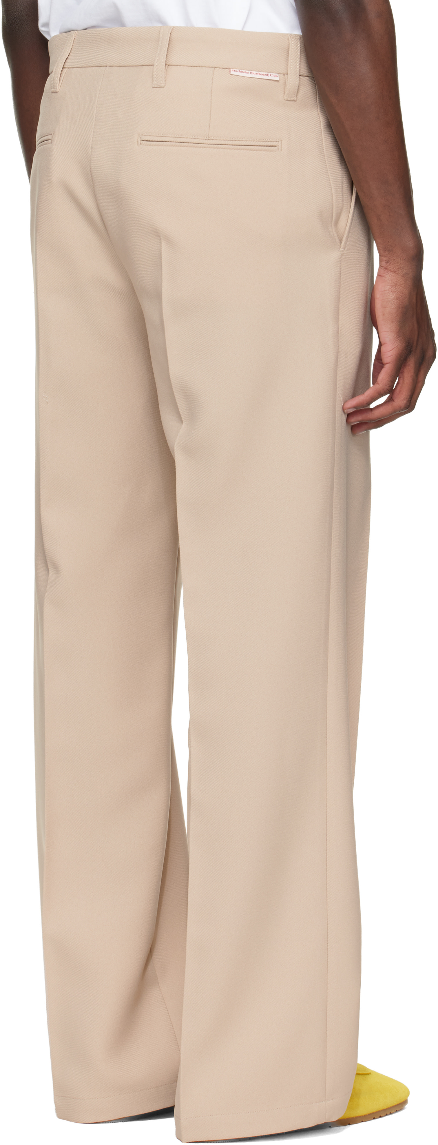 Stockholm (Surfboard) Club: Beige Tailored Bootcut Trousers | SSENSE