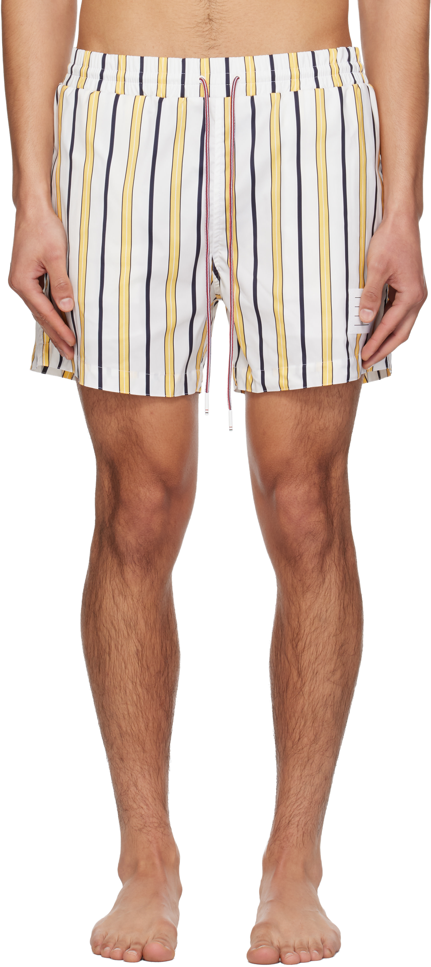 Thom Browne: White & Yellow Repp Stripe Swim Shorts | SSENSE