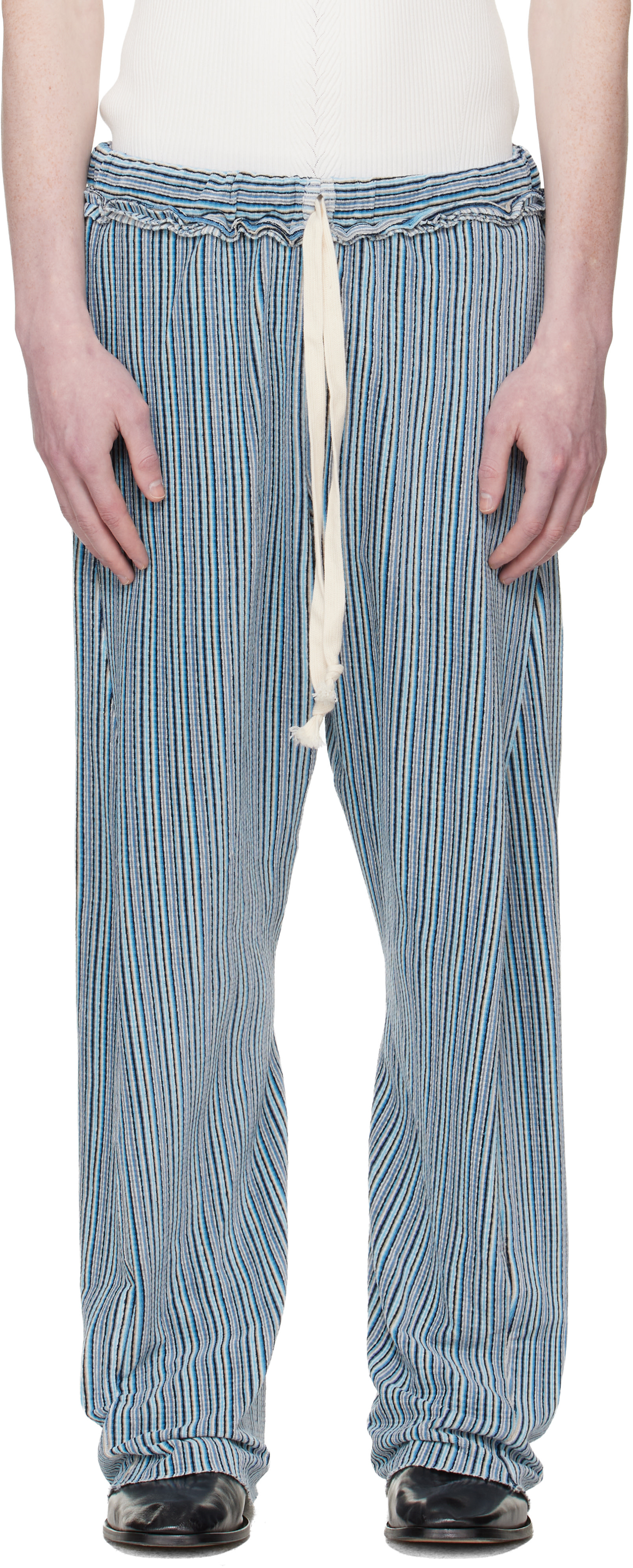 Edward Cuming: Blue Twisted Track Pants | SSENSE Germany