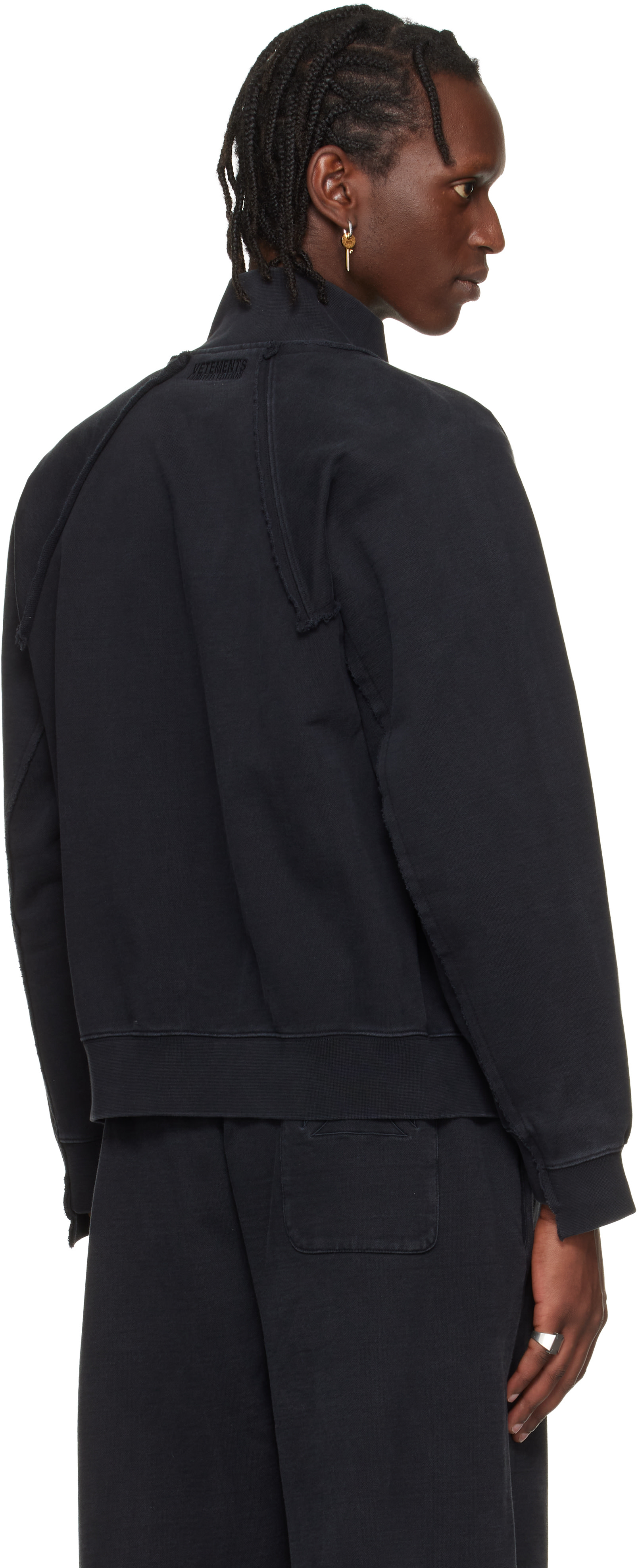 VETEMENTS: Black Biker Cross Fitted Zip-Up Track Jacket | SSENSE