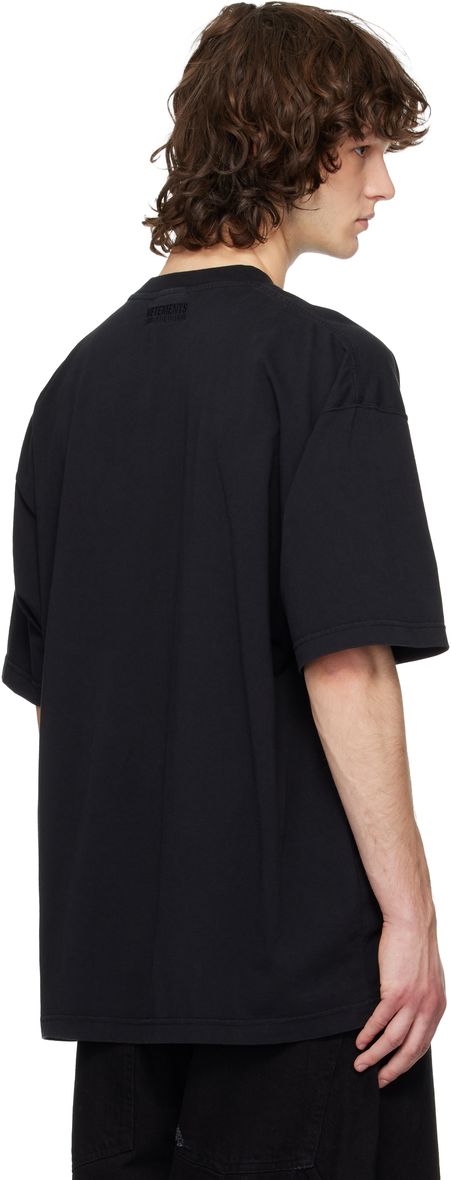 VETEMENTS: Black Sticker T-shirt | SSENSE