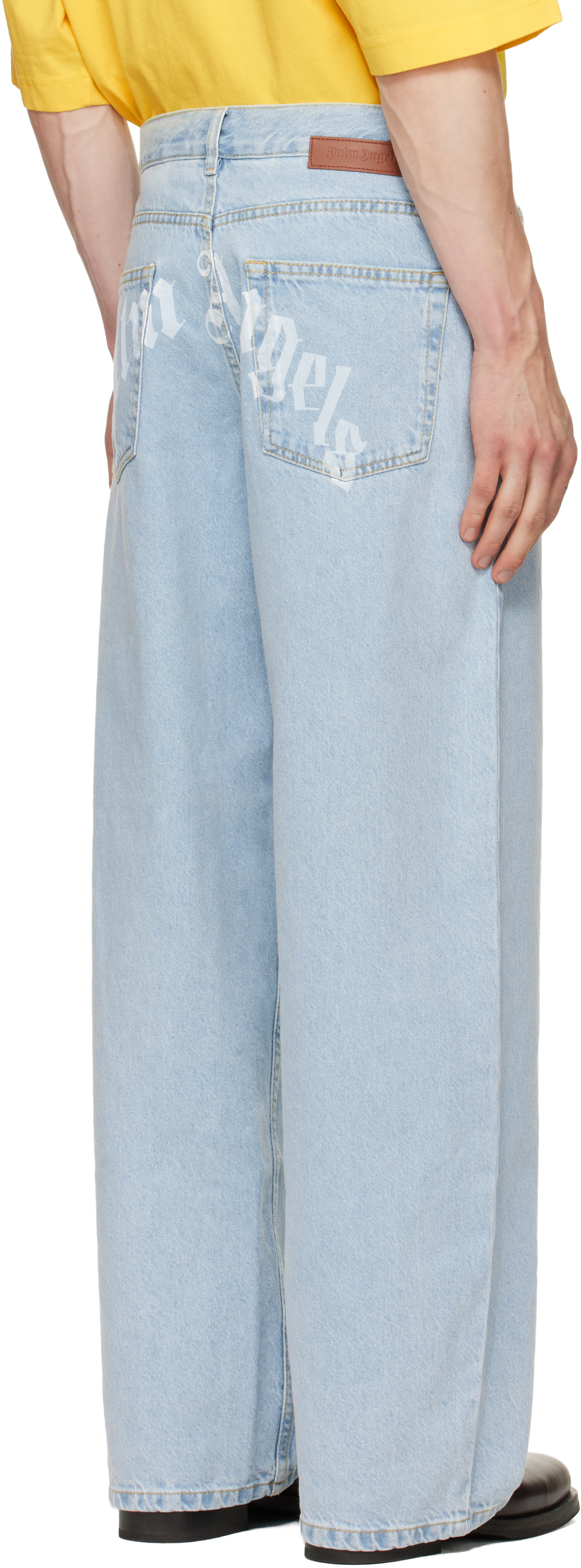 Palm Angels: Blue Curved Logo Loose Jeans | SSENSE