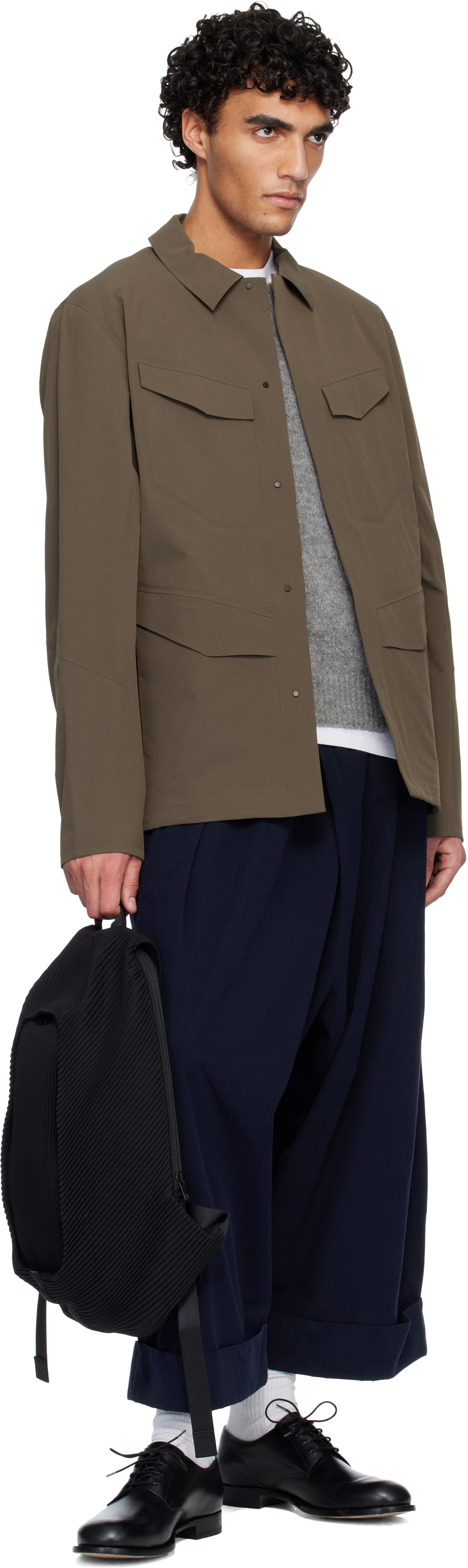HOMME PLISSÉ ISSEY MIYAKE: Black Pleats Backpack | SSENSE