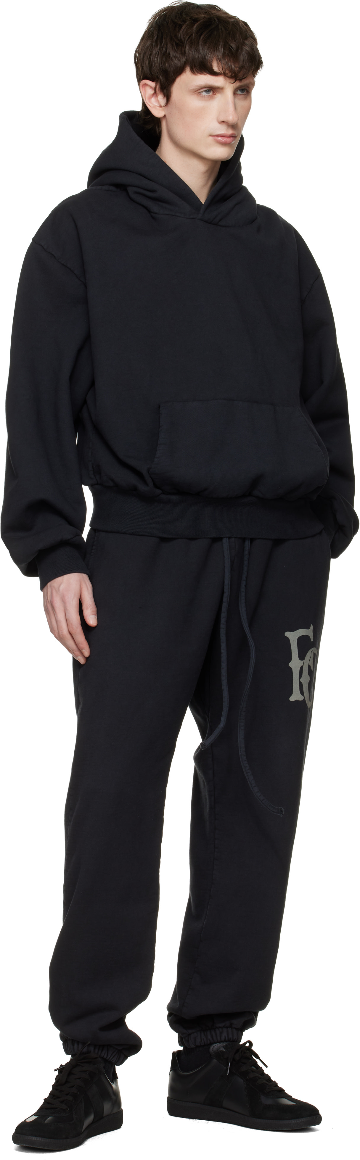 Fear of God: Black Sunfaded Classic Half Raglan Pocket Hoodie | SSENSE