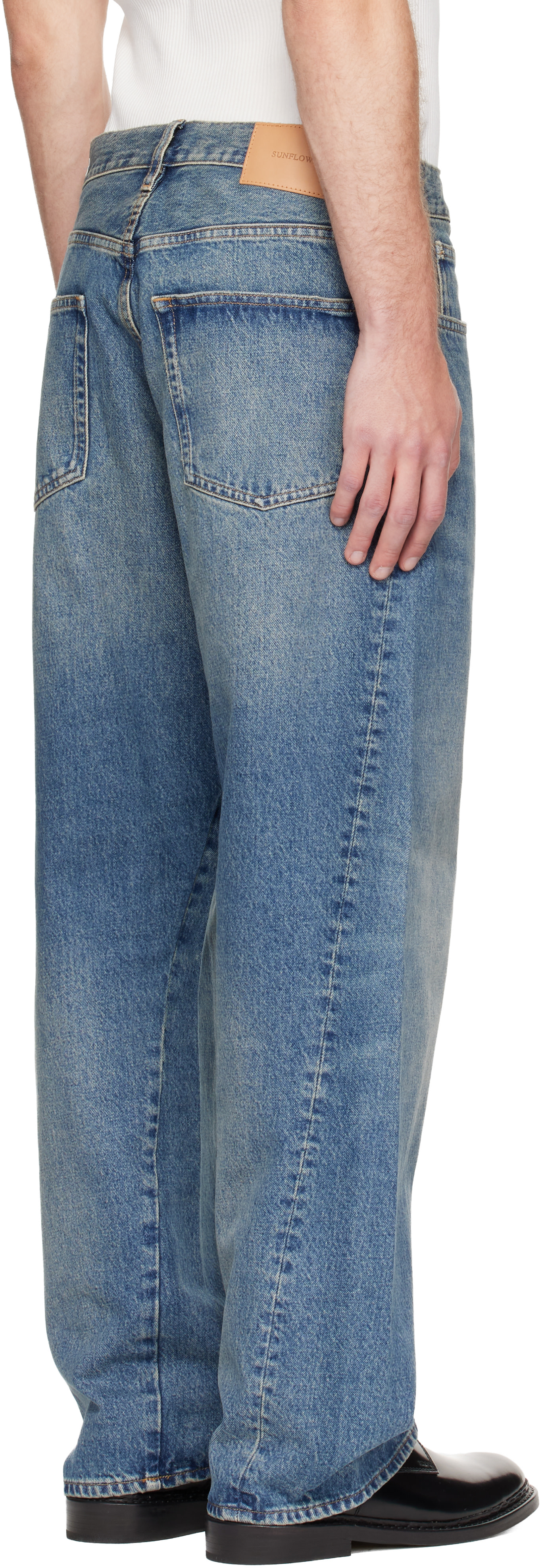 Sunflower: Blue Wide Twist Jeans | SSENSE