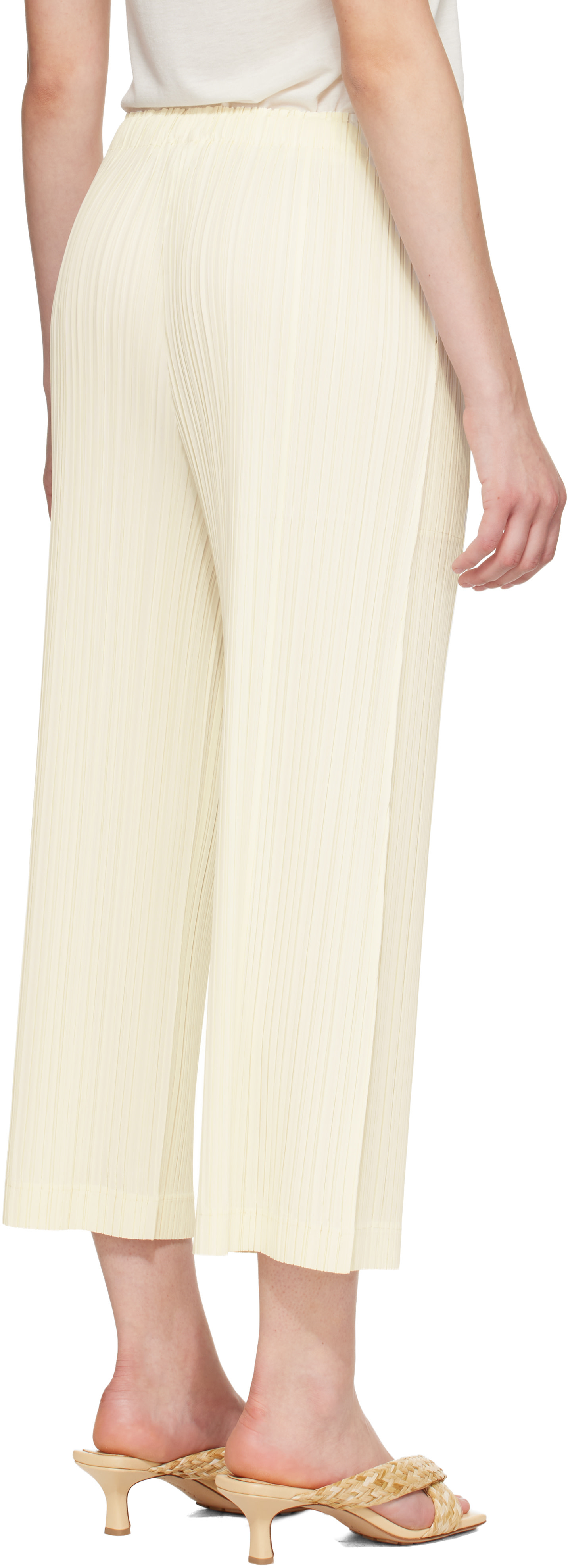 PLEATS PLEASE ISSEY MIYAKE: Off-White Opaque Trousers | SSENSE