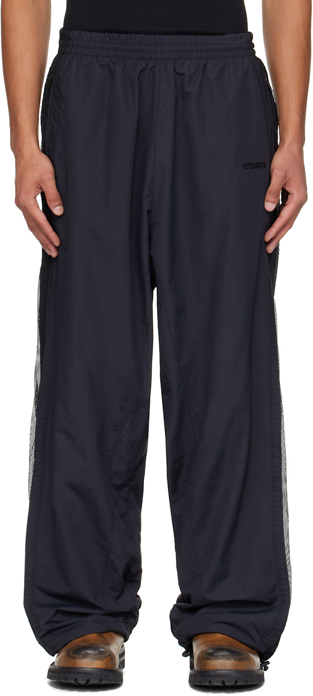 VETEMENTS: Black Mesh Panel Track Pants | SSENSE