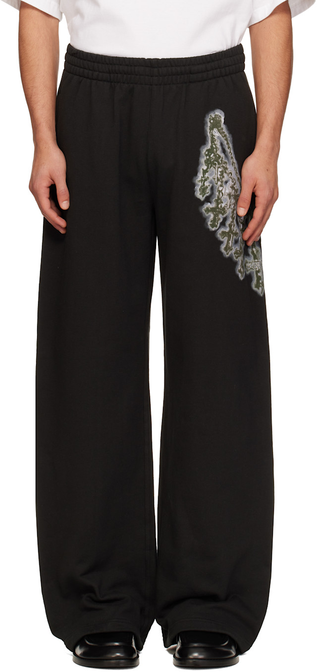 We11done: Black Cross Chain Sweatpants | SSENSE