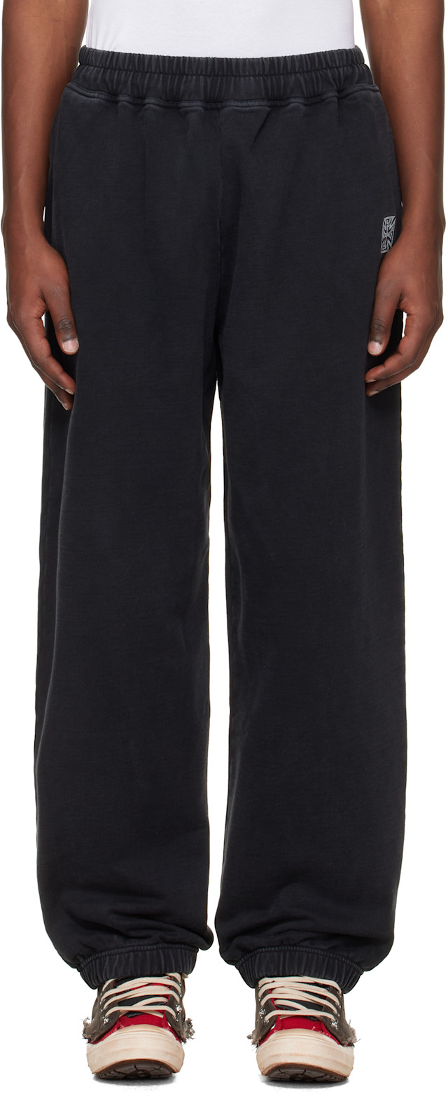 VETEMENTS: Black Biker Cross Logo Sweatpants | SSENSE