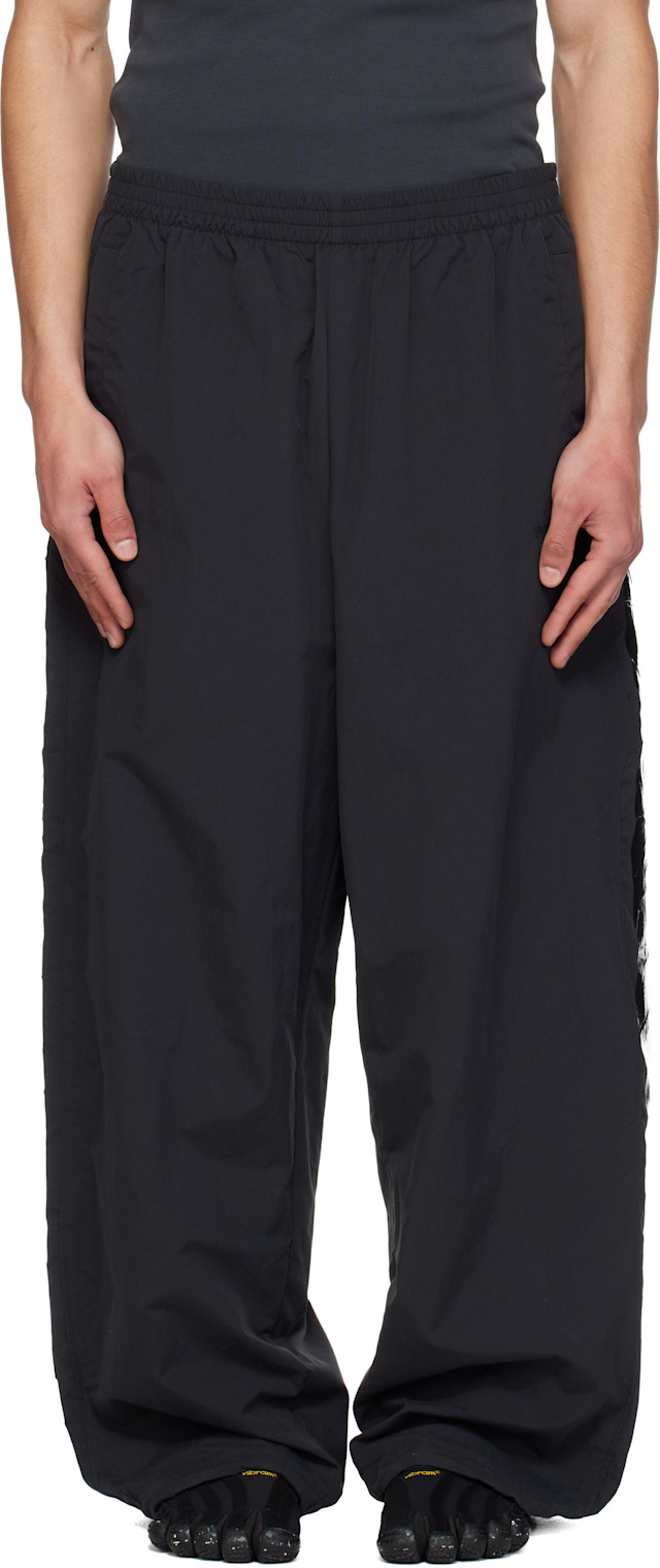 VETEMENTS: Black Taped Track Pants | SSENSE