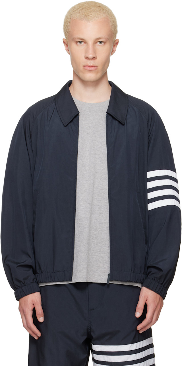 THOM BROWNE ネイビー スタジャン Thom Browne: Navy Ripstop Raglan Coach Jacket | SSENSE