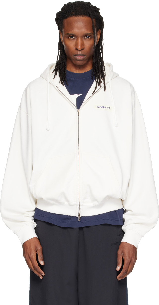 VETEMENTS: White Scribbled Logo Zip Up Hoodie | SSENSE