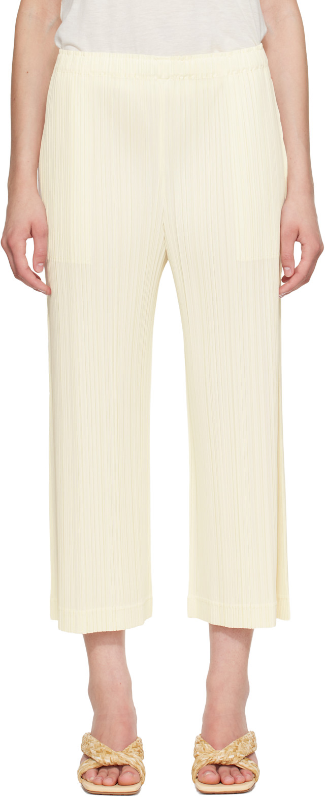 PLEATS PLEASE ISSEY MIYAKE: Off-White Opaque Trousers | SSENSE